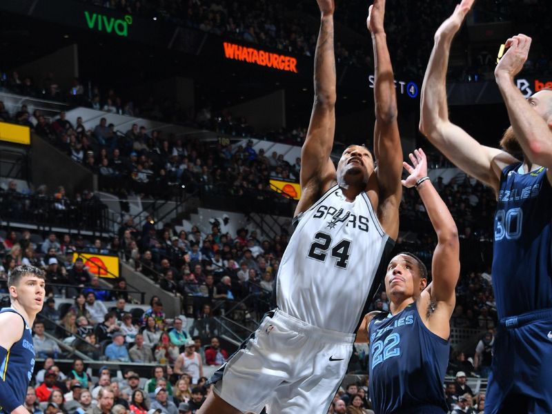 SAN ANTONIO, TX - JANUARY 17: Devin Vassell #24 of the San Antonio Spurs rebounds the ball during the game against the Memphis Grizzlies on January 17, 2025 at the Frost Bank Center in San Antonio, Texas. NOTE TO USER: User expressly acknowledges and agrees that, by downloading and or using this photograph, user is consenting to the terms and conditions of the Getty Images License Agreement. Mandatory Copyright Notice: Copyright 2025 NBAE (Photos by Michael Gonzales/NBAE via Getty Images)