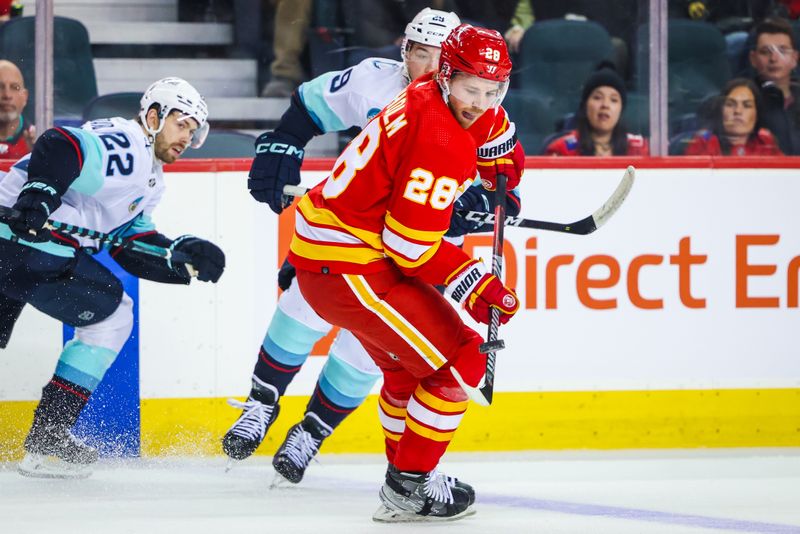 Dec 27, 2023; Calgary, Alberta, CAN; Calgary Flames center Elias Lindholm (28) controls the puck against the Seattle Kraken during the first period at Scotiabank Saddledome. Mandatory Credit: Sergei Belski-USA TODAY Sports