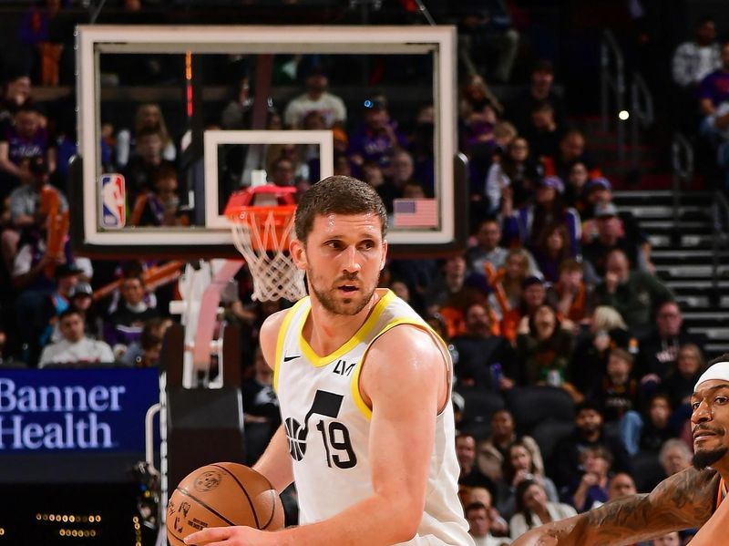 PHOENIX, AZ - JANUARY 11: Svi Mykhailiuk #19 of the Utah Jazz dribbles the ball during the game against the Utah Jazz on January 11, 2025 at Footprint Center in Phoenix, Arizona. NOTE TO USER: User expressly acknowledges and agrees that, by downloading and or using this photograph, user is consenting to the terms and conditions of the Getty Images License Agreement. Mandatory Copyright Notice: Copyright 2025 NBAE (Photo by Kate Frese/NBAE via Getty Images)