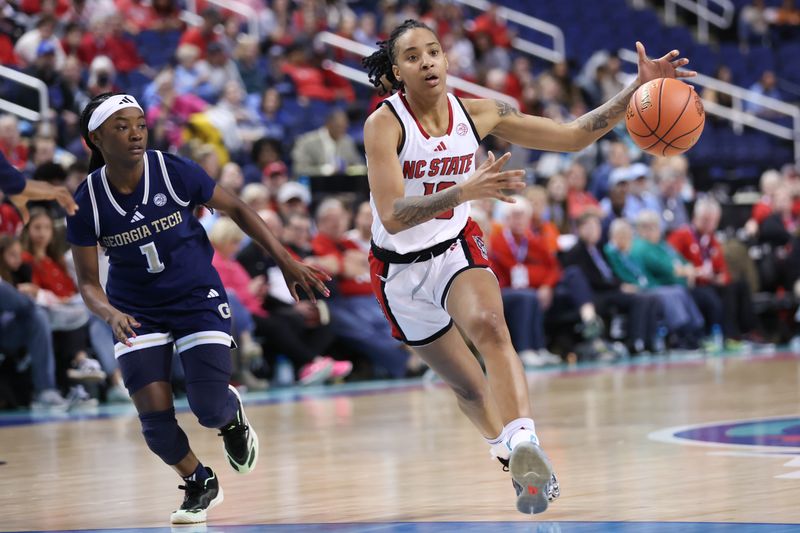 Mar 7, 2025; Greensboro, NC, USA;  NC State Wolfpack guard Aziaha James (10) drives the ball down court during the third quarter against Georgia Tech Yellow Jackets at First Horizon Coliseum. Mandatory Credit: Cory Knowlton-Imagn Images