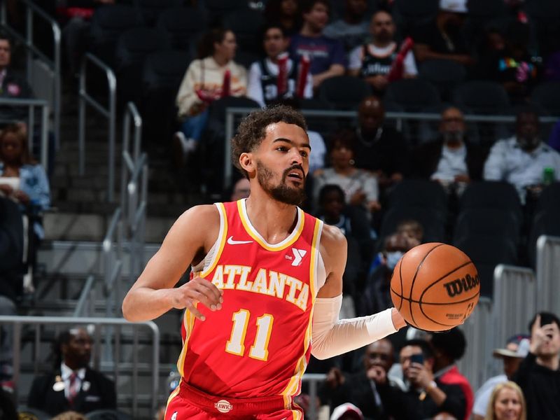 ATLANTA, GA - APRIL 10: Trae Young #11 of the Atlanta Hawks dribbles the ball during the game against the Charlotte Hornets on April 10, 2024 at State Farm Arena in Atlanta, Georgia.  NOTE TO USER: User expressly acknowledges and agrees that, by downloading and/or using this Photograph, user is consenting to the terms and conditions of the Getty Images License Agreement. Mandatory Copyright Notice: Copyright 2024 NBAE (Photo by Scott Cunningham/NBAE via Getty Images)