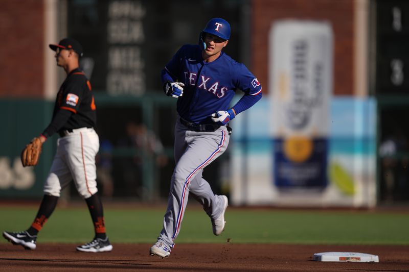 Aug 12, 2023; San Francisco, California, USA; Texas Rangers shortstop Corey Seager (5) rounds the bases after hitting a home run against the San Francisco Giants during the first inning at Oracle Park. Mandatory Credit: Darren Yamashita-USA TODAY Sports
