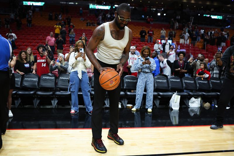 MIAMI, FLORIDA - JANUARY 14: Former Miami Heat player Dwayne Wade shoots a basket after a game between the Charlotte Hornets and Miami Heat at Kaseya Center on January 14, 2024 in Miami, Florida. NOTE TO USER: User expressly acknowledges and agrees that, by downloading and or using this photograph, User is consenting to the terms and conditions of the Getty Images License Agreement.  (Photo by Megan Briggs/Getty Images)