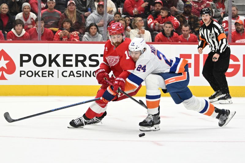 Nov 21, 2024; Detroit, Michigan, USA; Detroit Red Wings center Tyler Motte (14) and New York Islanders defenseman Scott Mayfield (24) battle for the puck in the second period at Little Caesars Arena. Mandatory Credit: Lon Horwedel-Imagn Images