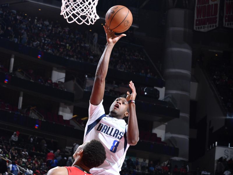 HOUSTON, TX - JANUARY 01   Olivier Maxence-Prosper #8 of the Dallas Mavericks shoots the ball during the game against the Houston Rockets on January 01, 2025 at the Toyota Center in Houston, Texas. NOTE TO USER: User expressly acknowledges and agrees that, by downloading and or using this photograph, User is consenting to the terms and conditions of the Getty Images License Agreement. Mandatory Copyright Notice: Copyright 2025 NBAE (Photo by Logan Riely/NBAE via Getty Images)