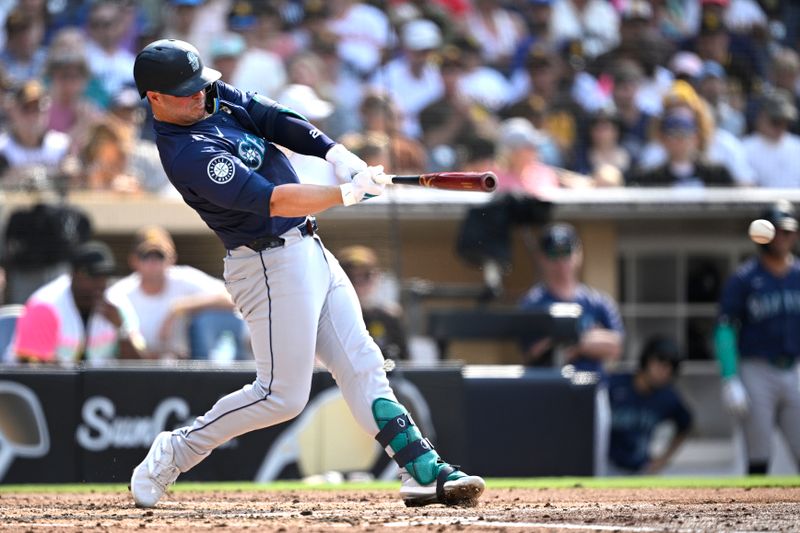 Jul 10, 2024; San Diego, California, USA; Seattle Mariners first baseman Ty France (23) hits a single against the San Diego Padres during the fourth inning at Petco Park. Mandatory Credit: Orlando Ramirez-USA TODAY Sports