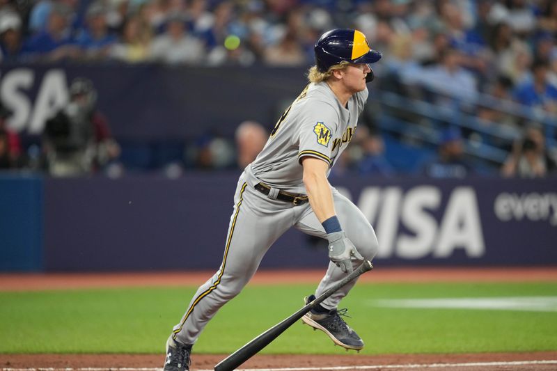 May 31, 2023; Toronto, Ontario, CAN; Milwaukee Brewers center fielder Joey Wiemer (28) hits a single against the Toronto Blue Jays during the seventh inning inning at Rogers Centre. Mandatory Credit: Nick Turchiaro-USA TODAY Sports