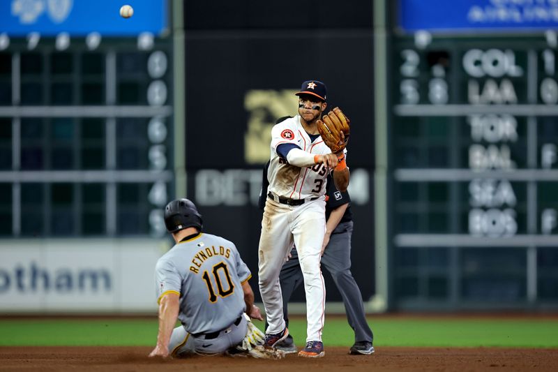 Jul 31, 2024; Houston, Texas, USA; Houston Astros shortstop Jeremy Peña (3) throws to first base to complete a double play against the Pittsburgh Pirates during the eighth inning at Minute Maid Park. Mandatory Credit: Erik Williams-USA TODAY Sports