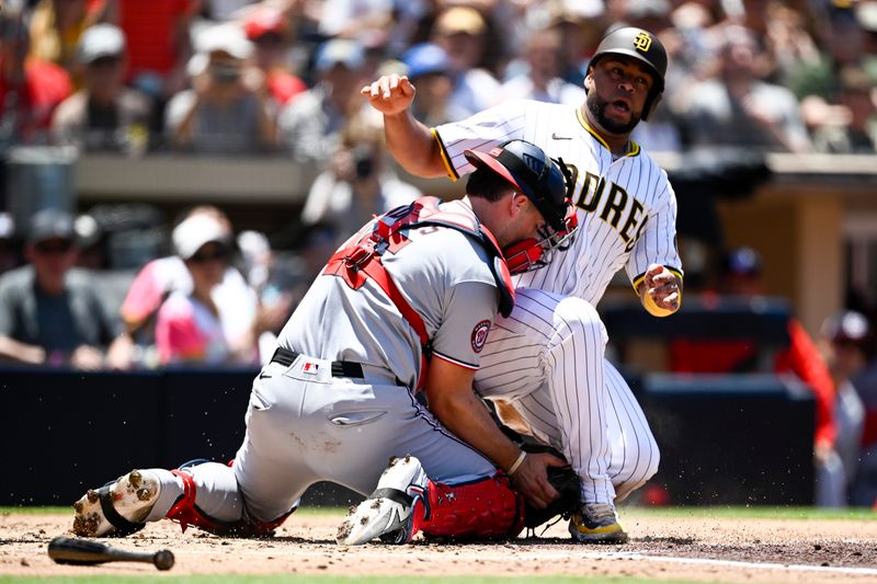Jun 25, 2025; San Diego, California, USA; San Diego Padres catcher Elias Diaz (17) is tagged out at the plate by Washington Nationals catcher Riley Adams (15) during the second inning at Petco Park. Mandatory Credit: Denis Poroy-Imagn Images