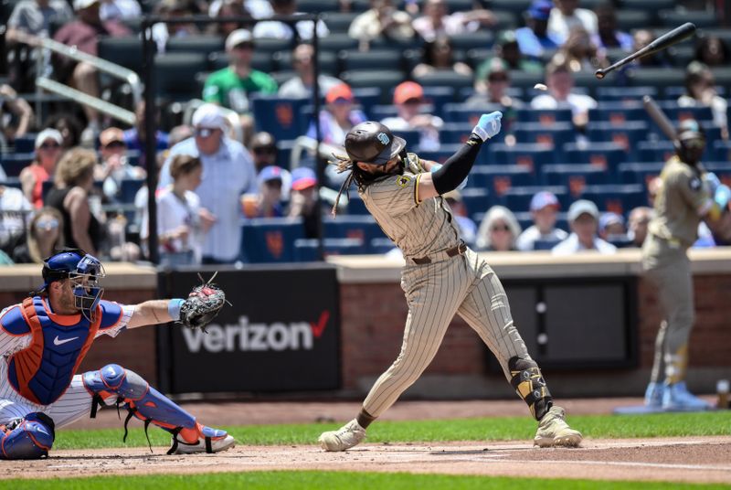 Jun 16, 2024; New York City, New York, USA; San Diego Padres outfielder Fernando Tatis Jr. (23) loses his bat after striking out against the New York Mets during the first inning at Citi Field. Mandatory Credit: John Jones-USA TODAY Sports