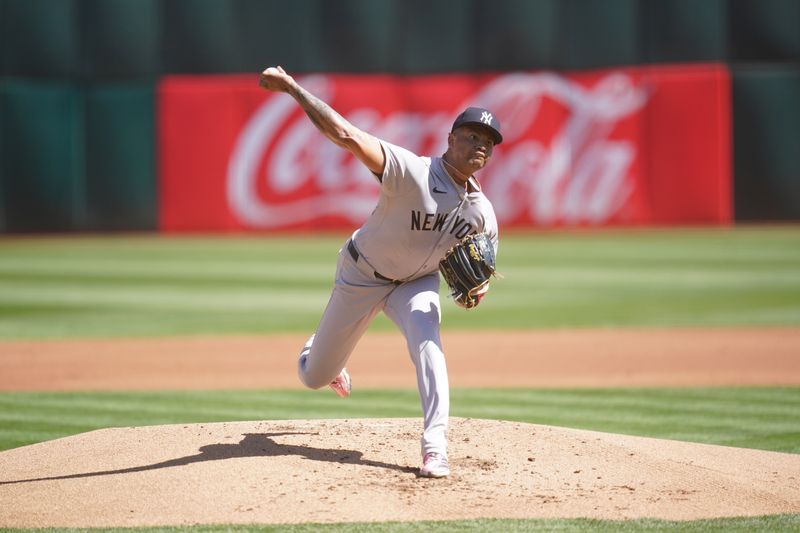 Sep 22, 2024; Oakland, California, USA; New York Yankees pitcher Luis Gil (81) delivers a pitch against the Oakland Athletics in the first inning at the Oakland-Alameda County Coliseum. Mandatory Credit: Cary Edmondson-Imagn Images