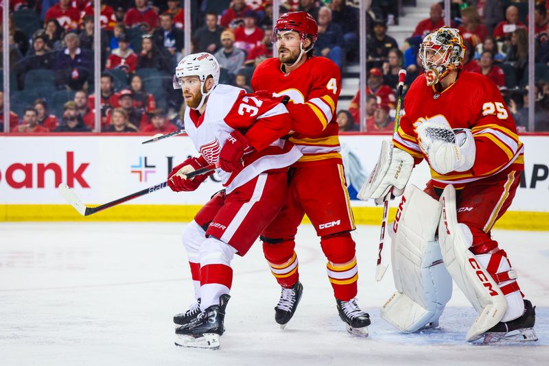 Feb 17, 2024; Calgary, Alberta, CAN; Detroit Red Wings left wing J.T. Compher (37) and Calgary Flames defenseman Rasmussen Andersson (4) fights for position in front of Calgary Flames goaltender Jacob Markstrom (25) during the second period at Scotiabank Saddledome. Mandatory Credit: Sergei Belski-USA TODAY Sports