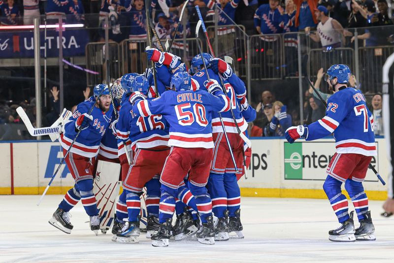 May 24, 2024; New York, New York, USA; New York Rangers center Barclay Goodrow (21) celebrates his game-winning overtime goal with teammates in game two of the Eastern Conference Final of the 2024 Stanley Cup Playoffs against the Florida Panthers at Madison Square Garden. Mandatory Credit: Vincent Carchietta-USA TODAY Sports