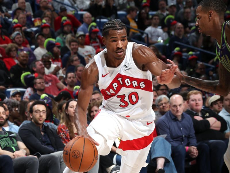 NEW ORLEANS, LA - NOVEMBER 27: Ochai Agbaji #30 of the Toronto Raptors drives to the basket during the game against the New Orleans Pelicans during a regular season game on November 27, 2024 at the Smoothie King Center in New Orleans, Louisiana. NOTE TO USER: User expressly acknowledges and agrees that, by downloading and or using this Photograph, user is consenting to the terms and conditions of the Getty Images License Agreement. Mandatory Copyright Notice: Copyright 2024 NBAE (Photo by Layne Murdoch Jr./NBAE via Getty Images)