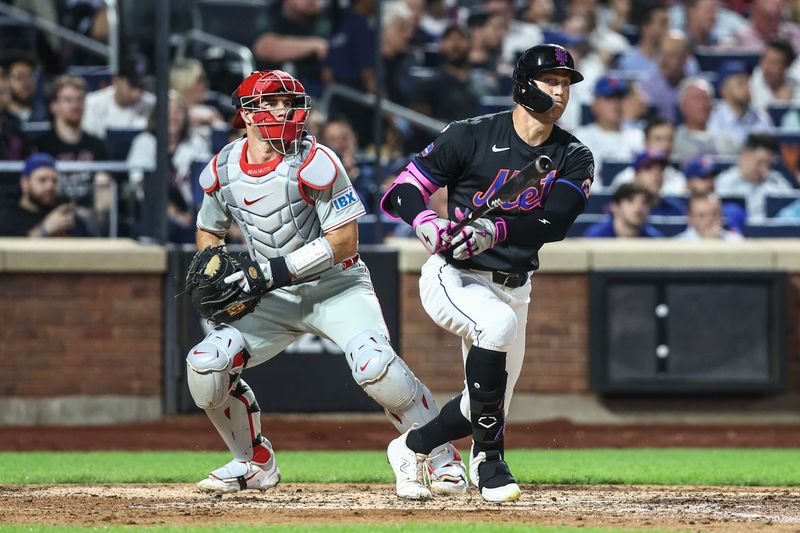 Sep 19, 2024; New York City, New York, USA;  New York Mets left fielder Brandon Nimmo (9) hits an RBI double in the fourth inning against the Philadelphia Phillies at Citi Field. Mandatory Credit: Wendell Cruz-Imagn Images