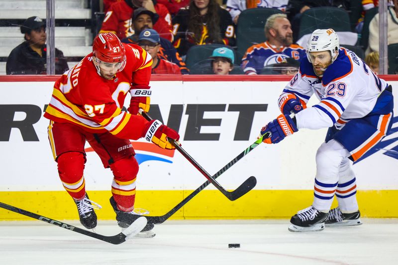 Nov 3, 2024; Calgary, Alberta, CAN; Calgary Flames right wing Matt Coronato (27) and Edmonton Oilers center Leon Draisaitl (29) battles for the puck during the second period at Scotiabank Saddledome. Mandatory Credit: Sergei Belski-Imagn Images