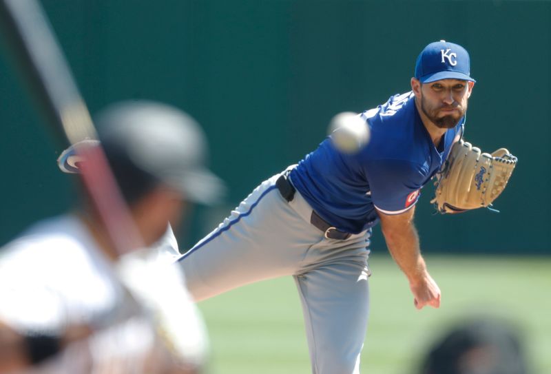 Sep 14, 2024; Pittsburgh, Pennsylvania, USA;  Kansas City Royals starting pitcher Michael Wacha (52) throws against Pittsburgh Pirates shortstop Isiah Kiner-Falefa (7) during the first inning at PNC Park. Mandatory Credit: Charles LeClaire-Imagn Images