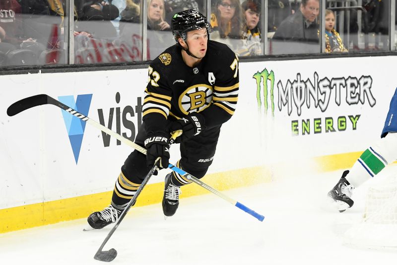 Feb 8, 2024; Boston, Massachusetts, USA; Boston Bruins defenseman Charlie McAvoy (73) controls the puck during the third period against the Vancouver Canucks at TD Garden. Mandatory Credit: Bob DeChiara-USA TODAY Sports