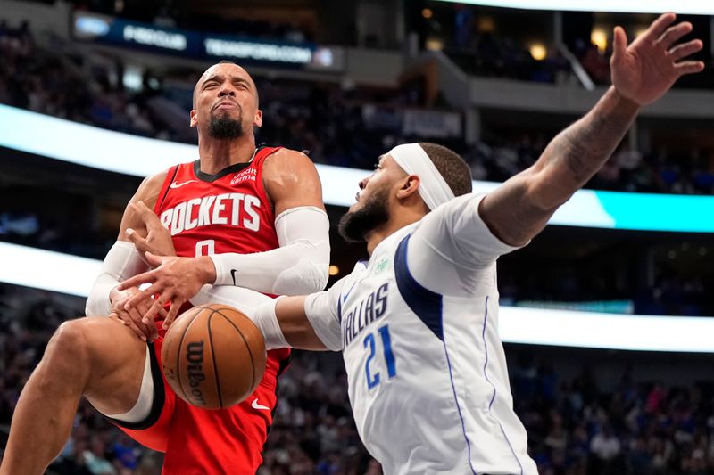 DALLAS, TEXAS - APRIL 07: Dillon Brooks #9 of the Houston Rockets is blocked by Daniel Gafford #21 of the Dallas Mavericks during the second half at American Airlines Center on April 07, 2024 in Dallas, Texas. NOTE TO USER: User expressly acknowledges and agrees that, by downloading and or using this photograph, User is consenting to the terms and conditions of the Getty Images License Agreement. (Photo by Sam Hodde/Getty Images)