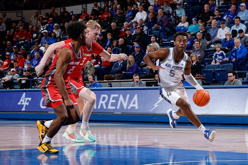 Feb 10, 2023; Colorado Springs, Colorado, USA; Air Force Falcons guard Ethan Taylor (5) drives to the net against New Mexico Lobos guard Donovan Dent (2) and center Sebastian Forsling (3) in the second half at Clune Arena. Mandatory Credit: Isaiah J. Downing-USA TODAY Sports