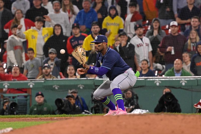 May 15, 2024; Boston, Massachusetts, USA; Tampa Bay Rays first baseman Yandy Diaz (2) catches the final out to win a game against the Boston Red Sox during the ninth inning at Fenway Park. Mandatory Credit: Eric Canha-USA TODAY Sports