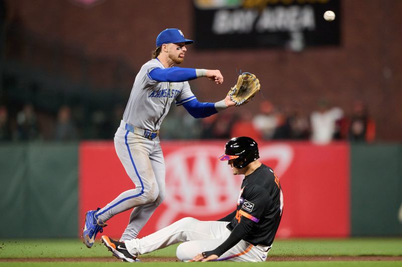 May 20, 2025; San Francisco, California, USA; Kansas City Royals shortstop Bobby Witt Jr. (7) turns a double play against San Francisco Giants first baseman Wilmer Flores (41) during the seventh inning at Oracle Park. Mandatory Credit: Robert Edwards-Imagn Images