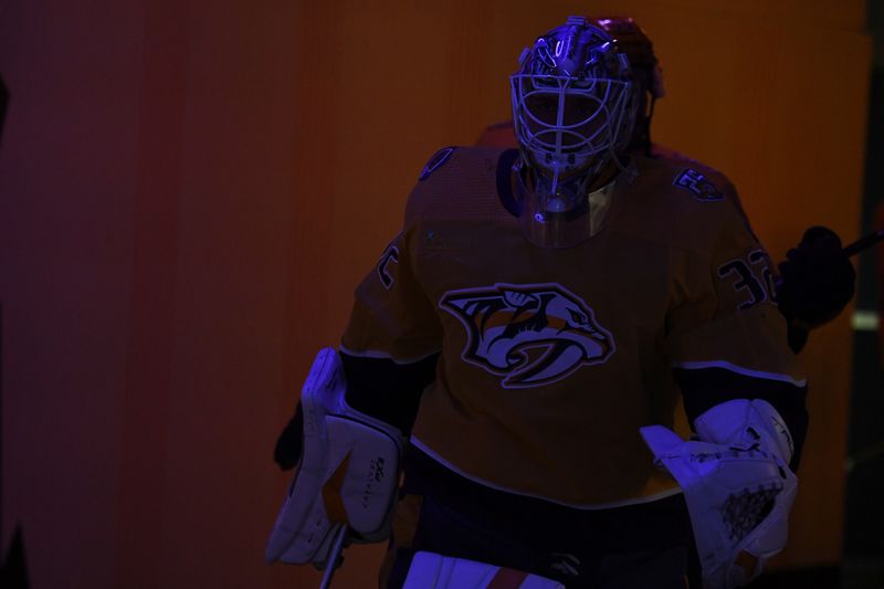 Dec 2, 2023; Nashville, Tennessee, USA; Nashville Predators goaltender Kevin Lankinen (32) walks to the ice for warmups before a game against the New York Rangers at Bridgestone Arena. Mandatory Credit: Christopher Hanewinckel-USA TODAY Sports