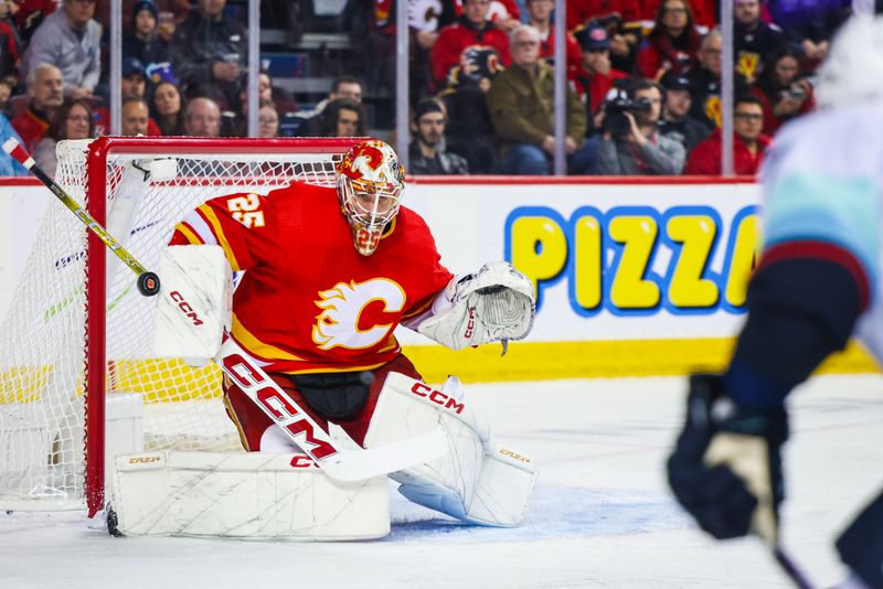 Dec 27, 2023; Calgary, Alberta, CAN; Calgary Flames goaltender Jacob Markstrom (25) makes a save against the Seattle Kraken during the first period at Scotiabank Saddledome. Mandatory Credit: Sergei Belski-USA TODAY Sports