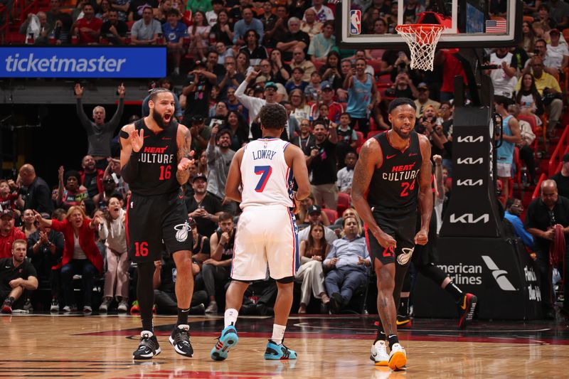 MIAMI, FL - APRIL 4: Haywood Highsmith #24 and Caleb Martin #16 of the Miami Heat celebrate during the game against the Philadelphia 76ers on April 4, 2024 at Kaseya Center in Miami, Florida. NOTE TO USER: User expressly acknowledges and agrees that, by downloading and or using this Photograph, user is consenting to the terms and conditions of the Getty Images License Agreement. Mandatory Copyright Notice: Copyright 2024 NBAE (Photo by Issac Baldizon/NBAE via Getty Images)