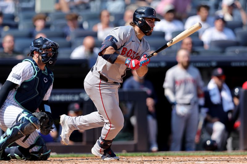 Sep 14, 2024; Bronx, New York, USA; Boston Red Sox right fielder Wilyer Abreu (52) follows through on a two run single against the New York Yankees during the fourth inning at Yankee Stadium. Mandatory Credit: Brad Penner-Imagn Images