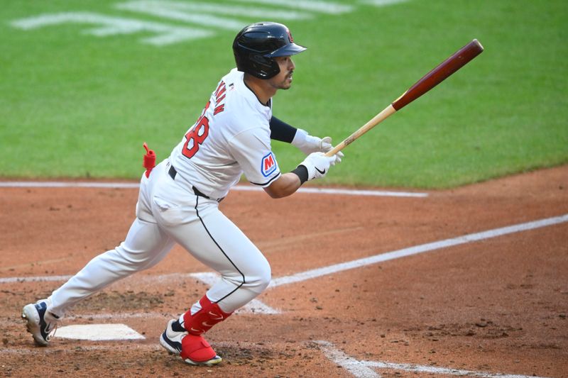 Aug 14, 2024; Cleveland, Ohio, USA; Cleveland Guardians left fielder Steven Kwan (38) singles in the fifth inning against the Chicago Cubs at Progressive Field. Mandatory Credit: David Richard-USA TODAY Sports