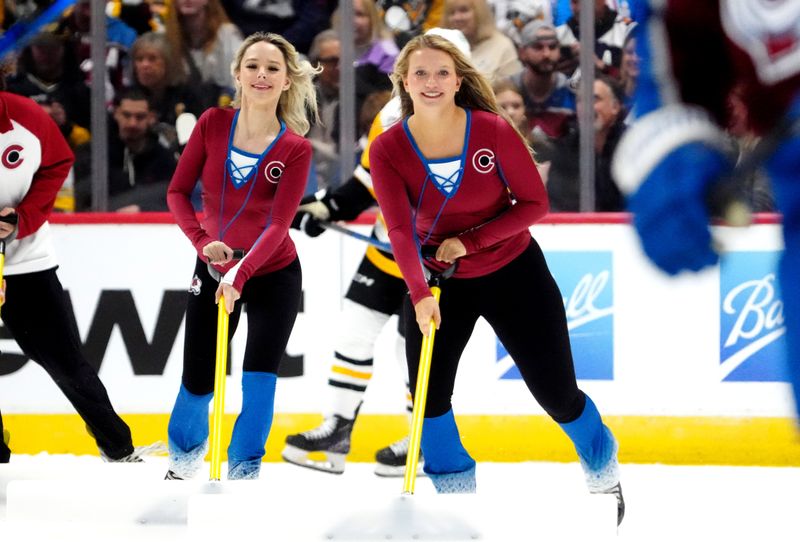 Mar 24, 2024; Denver, Colorado, USA; Colorado Avalanche ice patrol clears the rink in third period against the Pittsburgh Penguins at Ball Arena. Mandatory Credit: Ron Chenoy-USA TODAY Sports