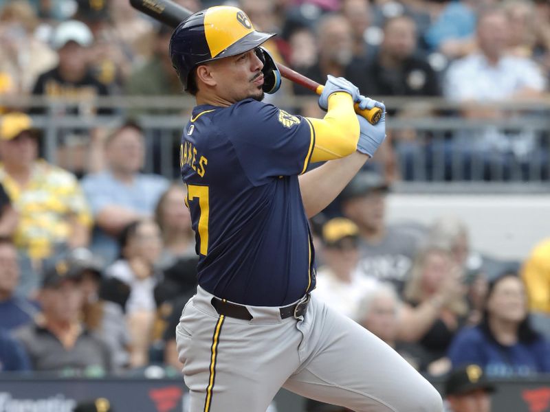 Sep 26, 2024; Pittsburgh, Pennsylvania, USA;  Milwaukee Brewers shortstop Willy Adames (27) hits a single against the Pittsburgh Pirates during the fourth inning at PNC Park. Mandatory Credit: Charles LeClaire-Imagn Images