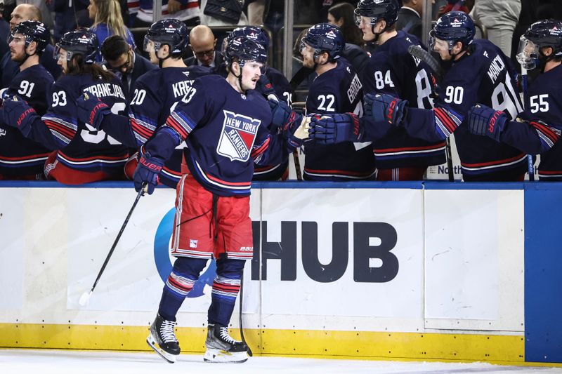 Oct 24, 2024; New York, New York, USA;  New York Rangers left wing Alexis Lafrenière (13) celebrates with his teammates after scoring a goal in the first period against the Florida Panthers at Madison Square Garden. Mandatory Credit: Wendell Cruz-Imagn Images