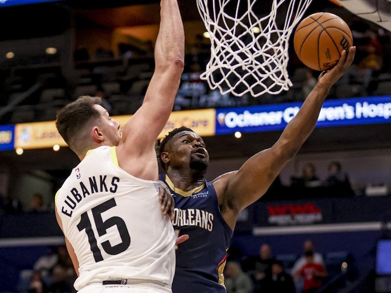 NEW ORLEANS, LOUISIANA - JANUARY 17:  Zion Williamson #1 of the New Orleans Pelicans shoots past Drew Eubanks #15 of the Utah Jazz during the first half of a game at the Smoothie King Center on January 17, 2025 in New Orleans, Louisiana. NOTE TO USER: User expressly acknowledges and agrees that, by downloading and or using this photograph, User is consenting to the terms and conditions of the Getty Images License Agreement. (Photo by Derick E. Hingle/Getty Images)