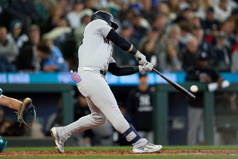 May 14, 2025; Seattle, Washington, USA; New York Yankees left fielder Jasson Dominguez (24) hits an RBI doube against the Seattle Mariners during the sixth inning at T-Mobile Park. Mandatory Credit: John Froschauer-Imagn Images