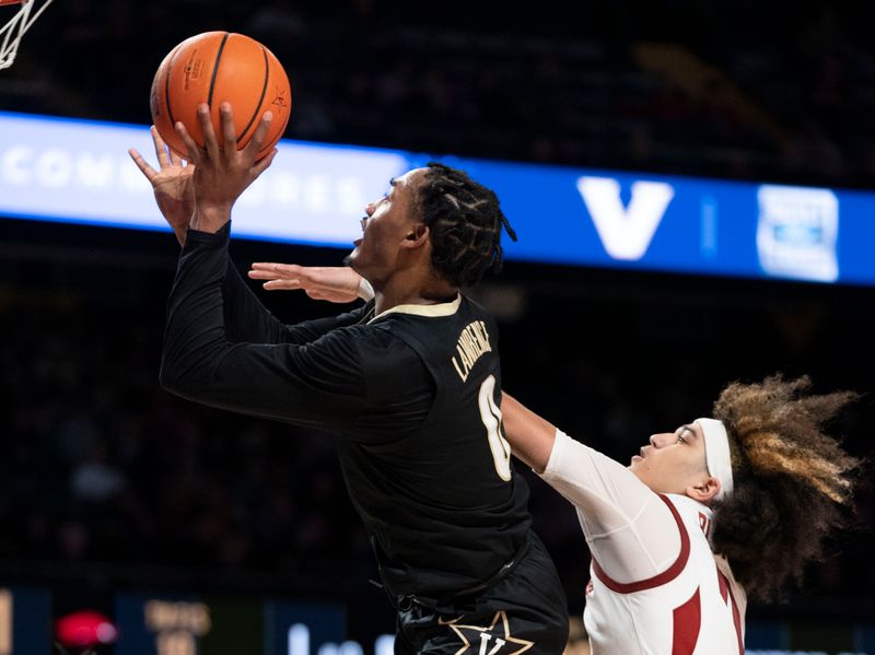 Jan 14, 2023; Nashville, Tennessee, USA;   
Vanderbilt Commodores guard Tyrin Lawrence (0) shoots the ball against Arkansas Razorbacks guard Anthony Black (0) during the second half at Memorial Gymnasium. Mandatory Credit: George Walker IV - USA TODAY Sports