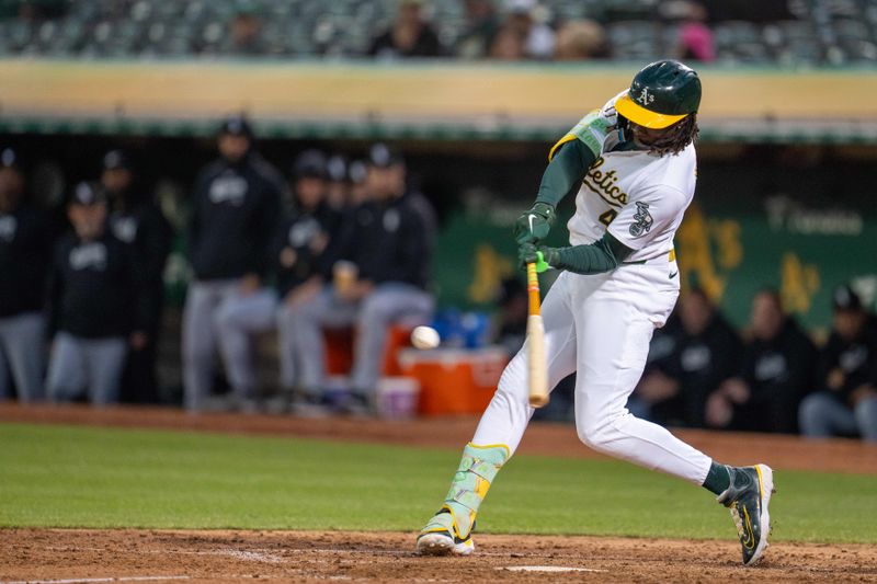 Aug 5, 2024; Oakland, California, USA;  Oakland Athletics outfielder Lawrence Butler (4) hits a solo homer against the Chicago White Sox during the sixth inning at Oakland-Alameda County Coliseum. Mandatory Credit: Neville E. Guard-USA TODAY Sports