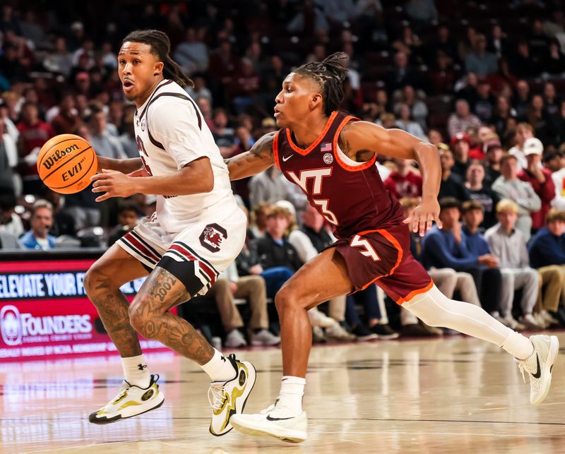 Dec 2, 2025; Columbia, South Carolina, USA; South Carolina Gamecocks guard Meechie Johnson (5) drives past Virginia Tech Hokies guard Ben Hammond (3) in the first half at Colonial Life Arena. Mandatory Credit: Jeff Blake-Imagn Images