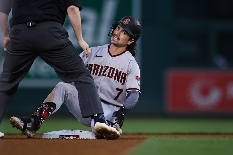 Jun 7, 2023; Washington, District of Columbia, USA; Arizona Diamondbacks left fielder Corbin Carroll (7) reacts after being tagged out at second base by Washington Nationals shortstop CJ Abrams (5) during the fifth inning at Nationals Park. Mandatory Credit: Scott Taetsch-USA TODAY Sports