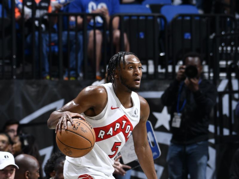 ORLANDO, FL - MARCH 17: Immanuel Quickley #5 of the Toronto Raptors dribbles the ball during the game against the Orlando Magic on March 17, 2024 at the Kia Center in Orlando, Florida. NOTE TO USER: User expressly acknowledges and agrees that, by downloading and or using this photograph, User is consenting to the terms and conditions of the Getty Images License Agreement. Mandatory Copyright Notice: Copyright 2024 NBAE (Photo by Fernando Medina/NBAE via Getty Images)