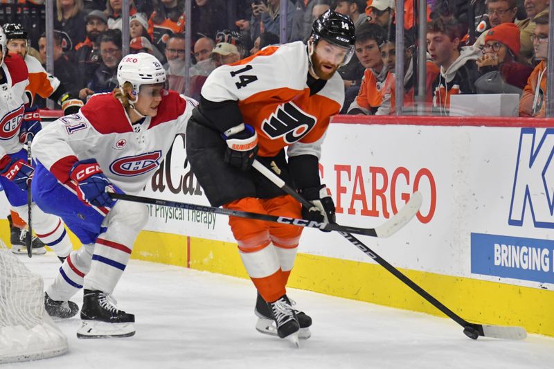 Jan 10, 2024; Philadelphia, Pennsylvania, USA; Philadelphia Flyers center Sean Couturier (14) and Montreal Canadiens defenseman Kaiden Guhle (21) battle for the puck during the first period at Wells Fargo Center. Mandatory Credit: Eric Hartline-USA TODAY Sports