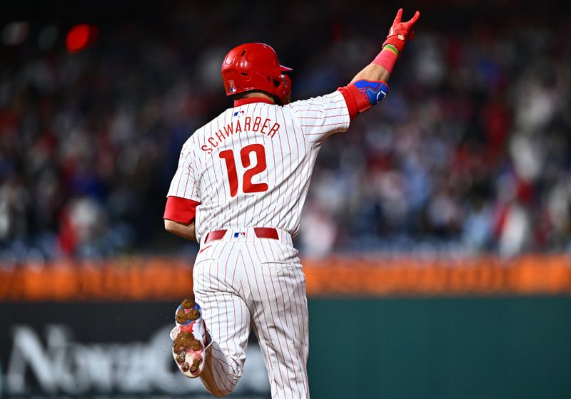 Apr 17, 2024; Philadelphia, Pennsylvania, USA; Philadelphia Phillies designated hitter Kyle Schwarber (12) rounds the bases after hitting a two-run home run against the Colorado Rockies in the sixth inning at Citizens Bank Park. Mandatory Credit: Kyle Ross-USA TODAY Sports