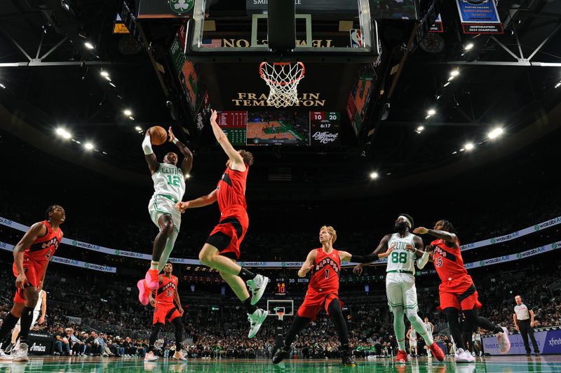 BOSTON, MA - OCTOBER 13: Lonnie Walker IV #12 of the Boston Celtics drives to the basket during the game against the Toronto Raptors during a NBA pre season game on October 13, 2024 at TD Garden in Boston, Massachusetts. NOTE TO USER: User expressly acknowledges and agrees that, by downloading and/or using this Photograph, user is consenting to the terms and conditions of the Getty Images License Agreement. Mandatory Copyright Notice: Copyright 2024 NBAE (Photo by Brian Babineau/NBAE via Getty Images)