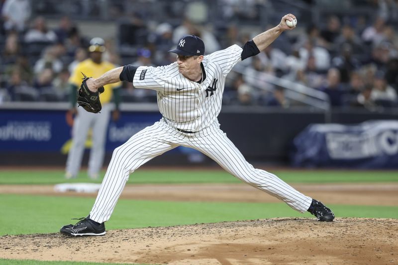 Jun 27, 2025; Bronx, New York, USA;  New York Yankees relief pitcher Tim Hill (41) pitches in the sixth inning against the Athletics at Yankee Stadium. Mandatory Credit: Wendell Cruz-Imagn Images