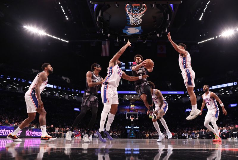 NEW YORK, NEW YORK - FEBRUARY 12:  Cameron Johnson #2 of the Brooklyn Nets shoots against Guerschon Yabusele #28 of the Philadelphia 76ers during their game at Barclays Center on February 12, 2025 in New York City. User expressly acknowledges and agrees that, by downloading and or using this photograph, User is consenting to the terms and conditions of the Getty Images License Agreement.   (Photo by Al Bello/Getty Images)