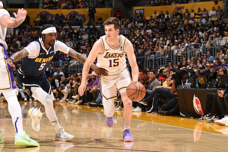 LOS ANGELES, CA - APRIL 27: Austin Reaves #15 of the Los Angeles Lakers dribbles the ball during the game against the Denver Nuggets during Round 1 Game 4 of the 2024 NBA Playoffs on April 27, 2024 at Crypto.Com Arena in Los Angeles, California. NOTE TO USER: User expressly acknowledges and agrees that, by downloading and/or using this Photograph, user is consenting to the terms and conditions of the Getty Images License Agreement. Mandatory Copyright Notice: Copyright 2024 NBAE (Photo by Andrew D. Bernstein/NBAE via Getty Images)