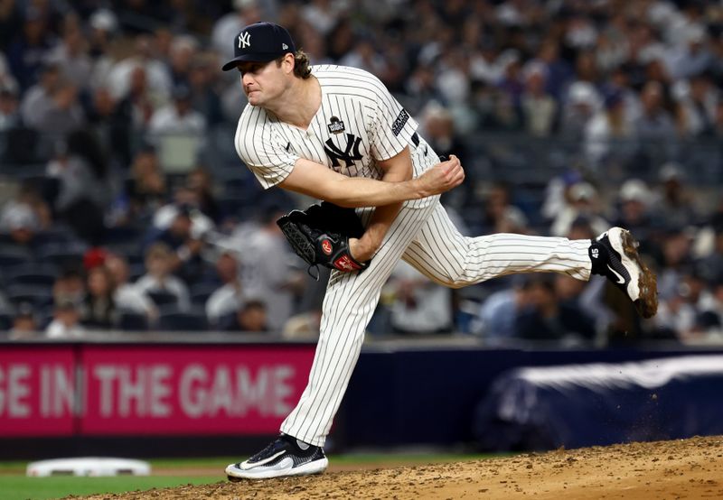 Oct 30, 2024; New York, New York, USA; New York Yankees pitcher Gerrit Cole (45) throws during the fourth inning against the Los Angeles Dodgers in game five of the 2024 MLB World Series at Yankee Stadium. Mandatory Credit: Vincent Carchietta-Imagn Images