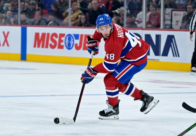 Oct 26, 2024; Montreal, Quebec, CAN; Montreal Canadiens defenseman Lane Hutson (48) plays the puck against the St.Louis Blues during the third period at the Bell Centre. Mandatory Credit: Eric Bolte-Imagn Images