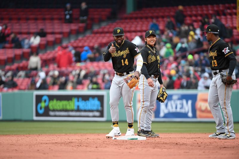 Apr 5, 2023; Boston, Massachusetts, USA; Pittsburgh Pirates second baseman Rodolfo Castro (14) signals to trainers after a ninth inning collision at second base during a game against the Boston Red Sox at Fenway Park. Mandatory Credit: Eric Canha-USA TODAY Sports